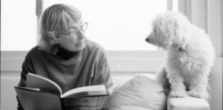 Mary Oliver reading to her dog.