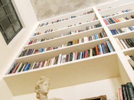 books on wall book shelf