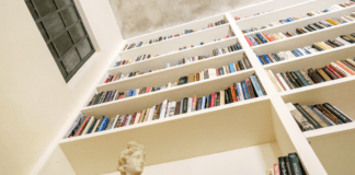 books on wall book shelf
