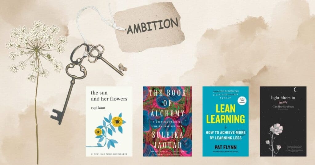 Vintage keys, a flower, and four books under a tag labeled ‘Ambition.’